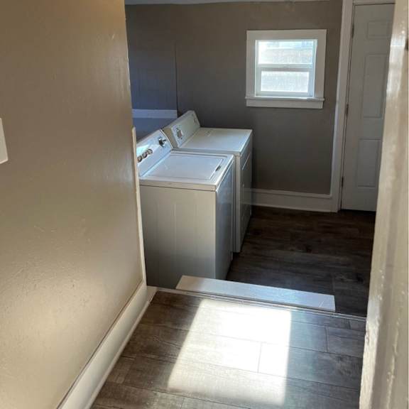 a small room with a washer and dryer.