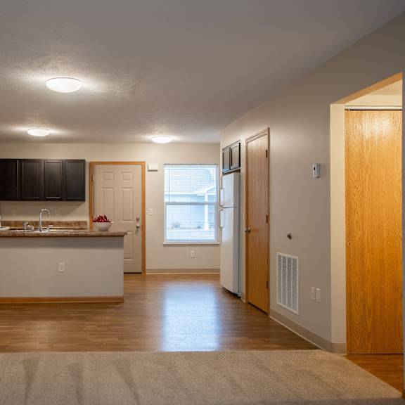 a kitchen with a white counter and a sink.