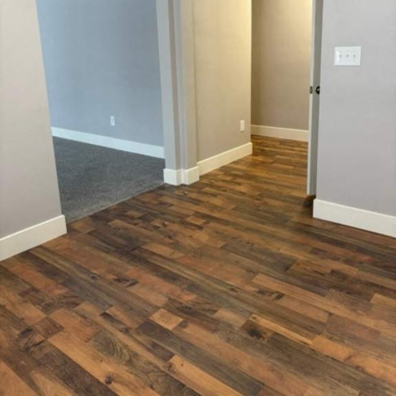a room with a wooden floor and a sliding door.