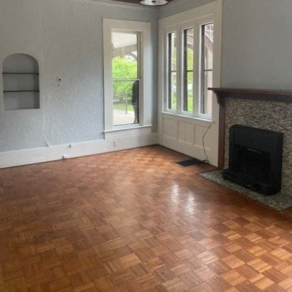 a room with a fireplace and a window.