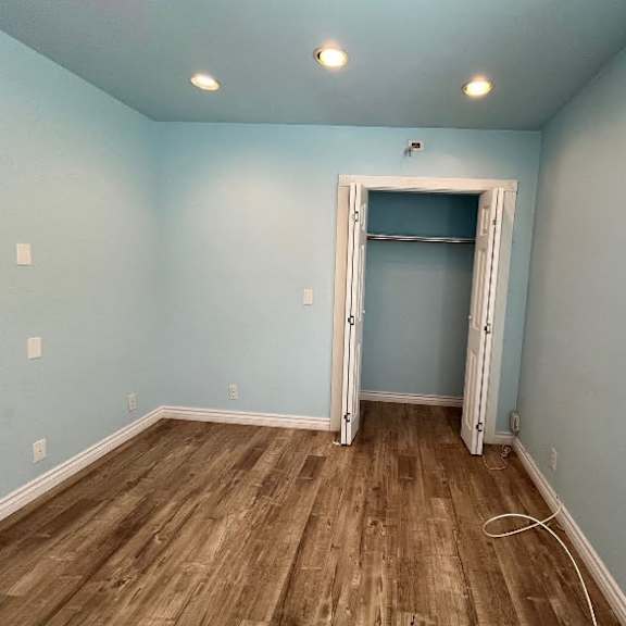 a room with a blue wall and a white door.