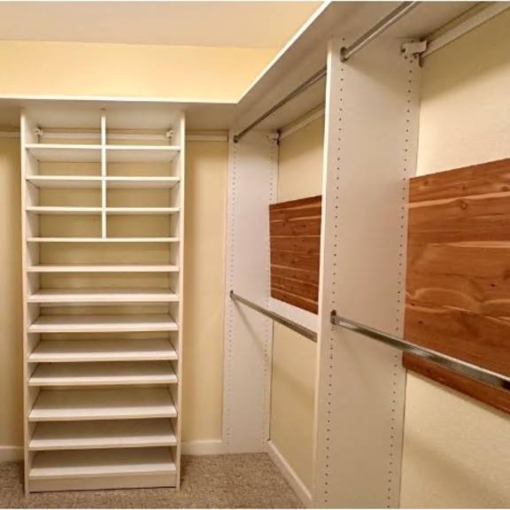 a white ladder in a room with white walls.