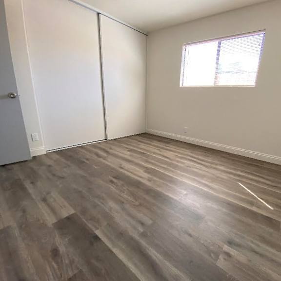 a room with a sliding door and a window.