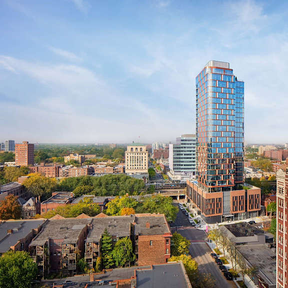 a cityscape with a large blue building in the center.