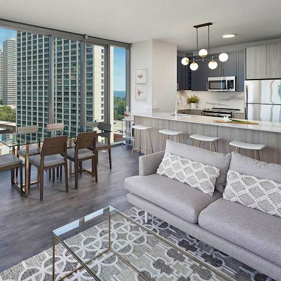 a modern living room with a view of the city.