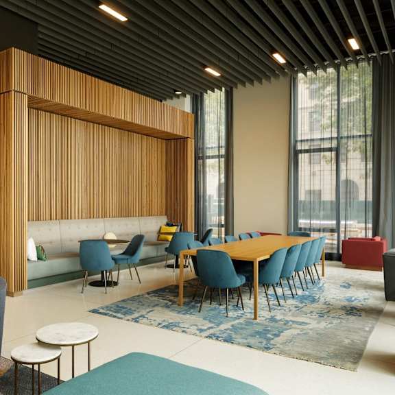a modern conference room with a long table and chairs.
