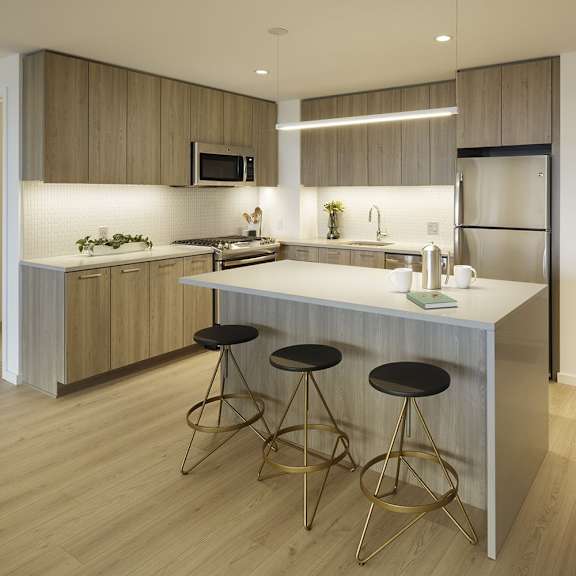a modern kitchen with a bar stool.