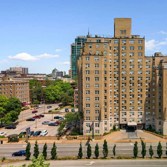 a large building with a parking lot in front of it.