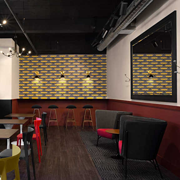 a restaurant with tables and chairs and a brick wall.