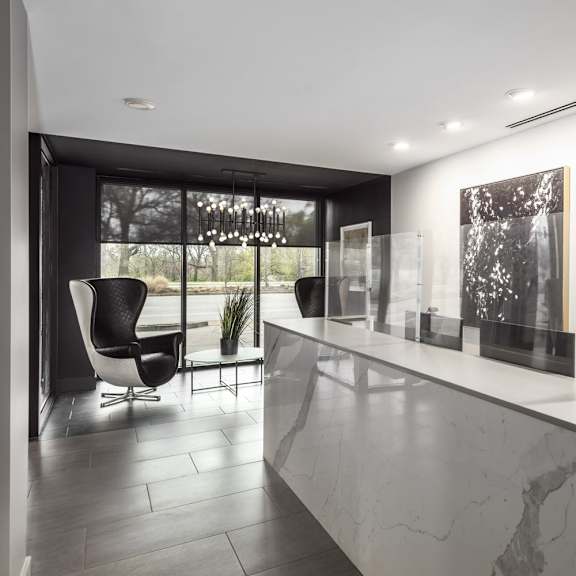 a black and white photo is on the wall above a counter.