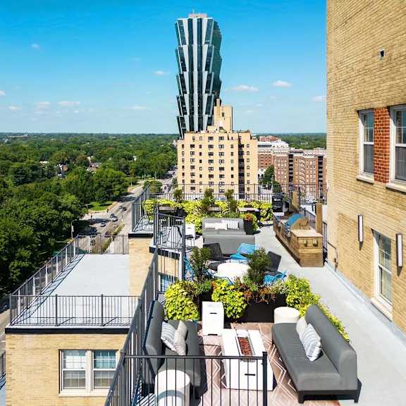 a view of a city from a high angle with a green building in the background.