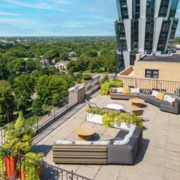 a rooftop patio with a view of the city.