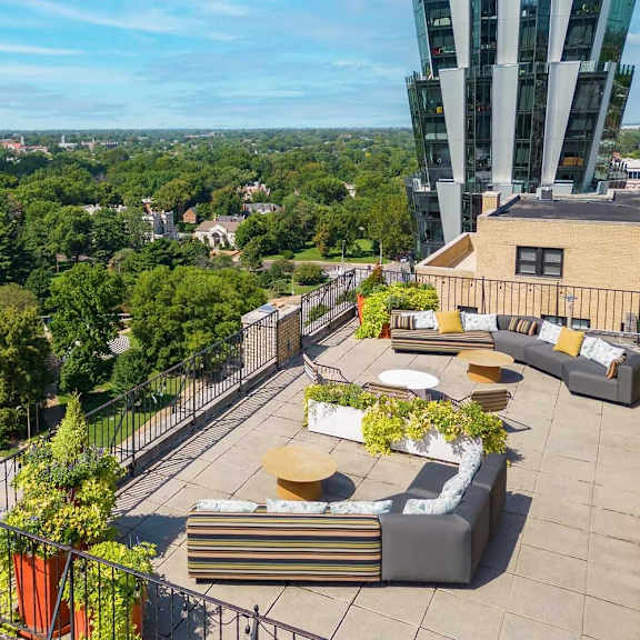 a rooftop patio with a view of the city.