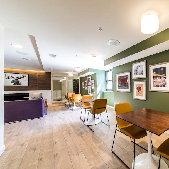 a room with a long table and chairs.