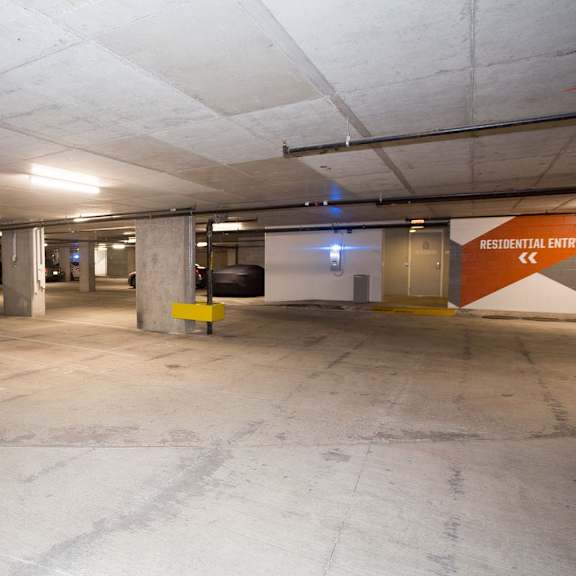 a parking garage with a sign that says
