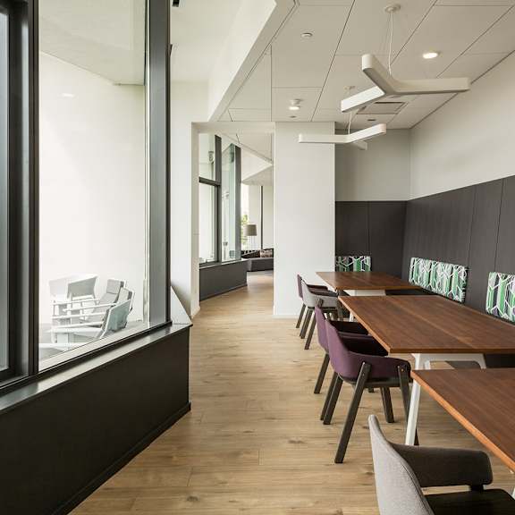 a conference room with a long table and chairs.