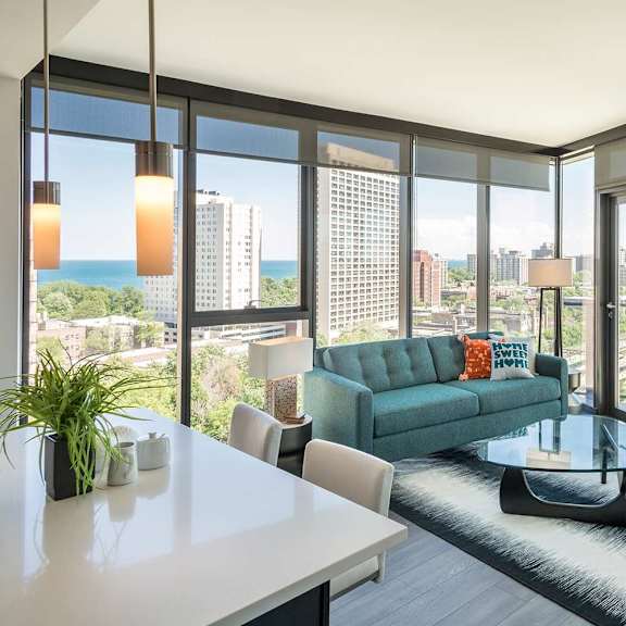 a modern living room with a view of the cityscape.