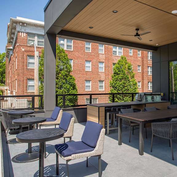 a patio with a table and chairs is shown.