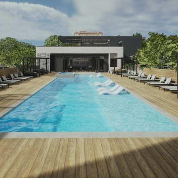 a large swimming pool with a wooden deck and lounge chairs.