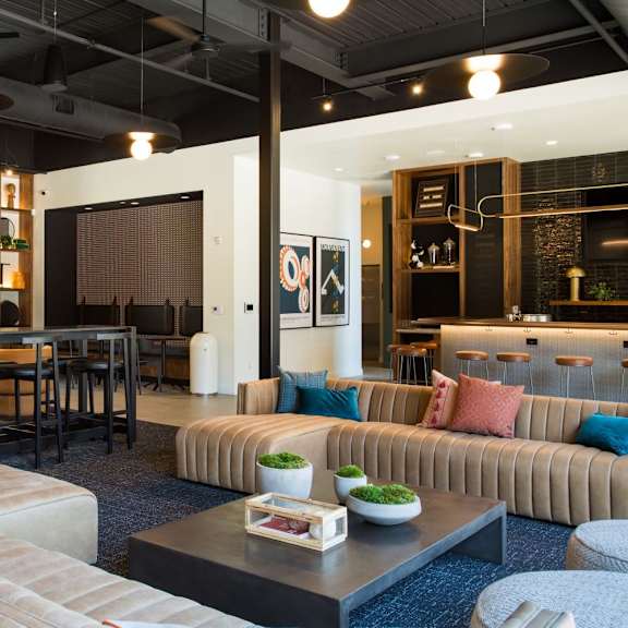a modern living room with a large couch and a coffee table.