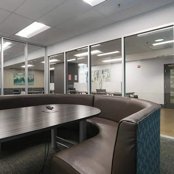 a conference room with a table and chairs.