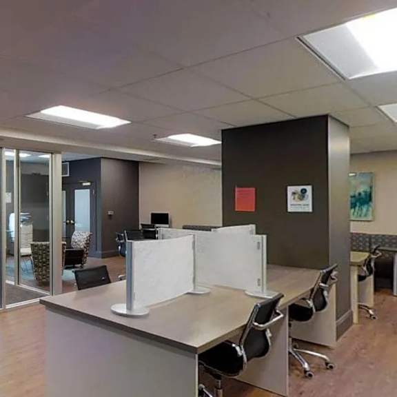 a conference room with a long table and chairs.