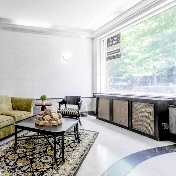 a living room with a sofa, armchair, and coffee table.