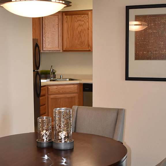 a dining room with a table and chairs.