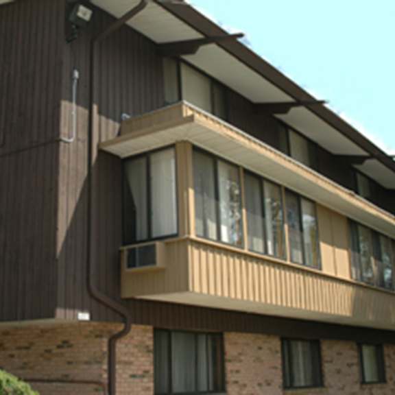 a building with a balcony and a staircase.