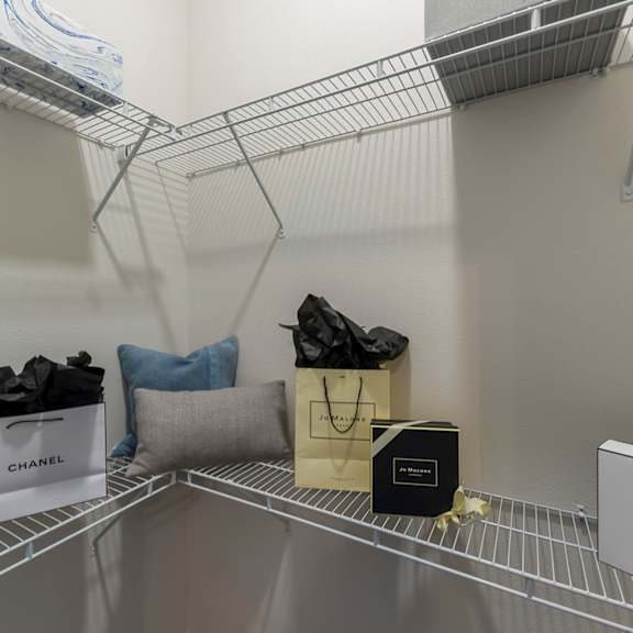 Thumbnail 4 of 9 Walk-in closet with wire shelving at Ciel Luxury Apartments, Jacksonville, FL 32246