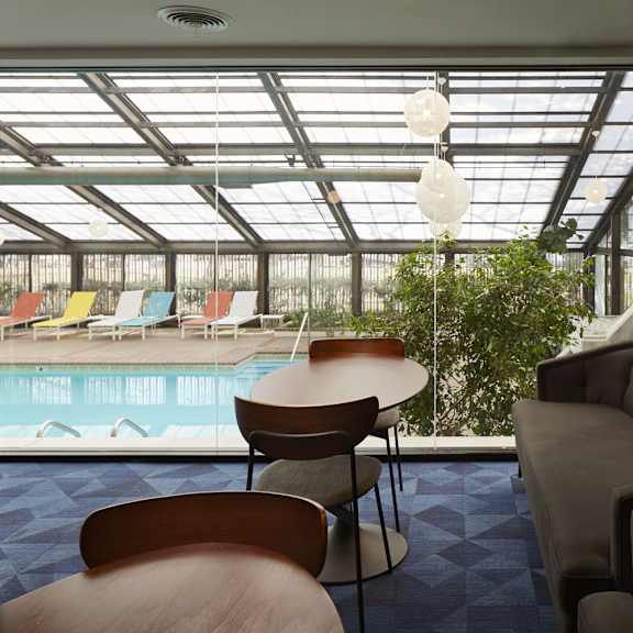 a room with a pool table and a couch.
