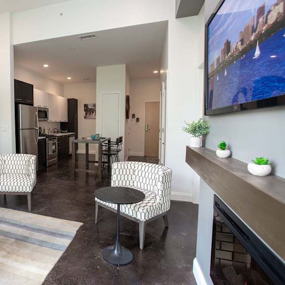a living room with a couch, two chairs, and a coffee table.