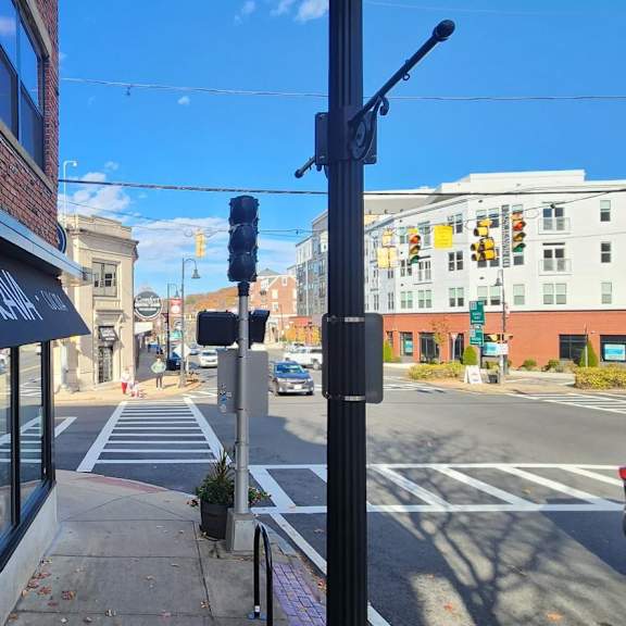 a street view with a black awning that says "dave's" on it.