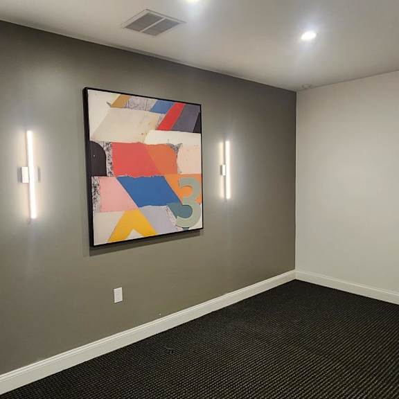 a hallway with a fire extinguisher on the wall.