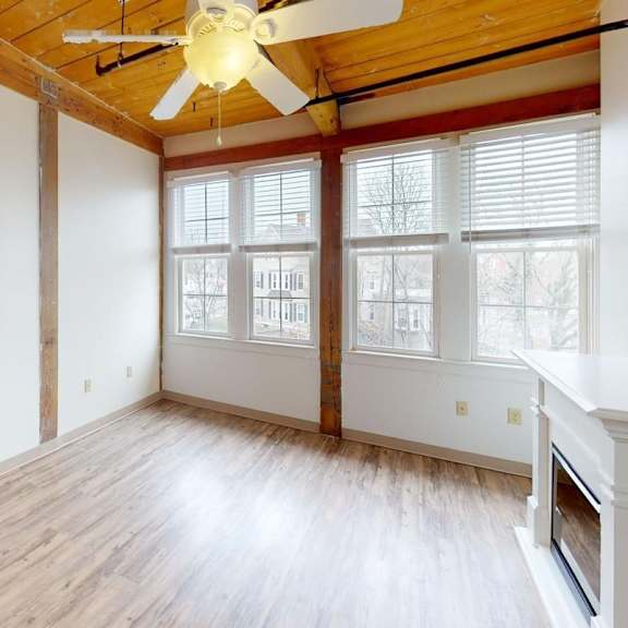 a kitchen with wooden cabinets and a black stove top oven.