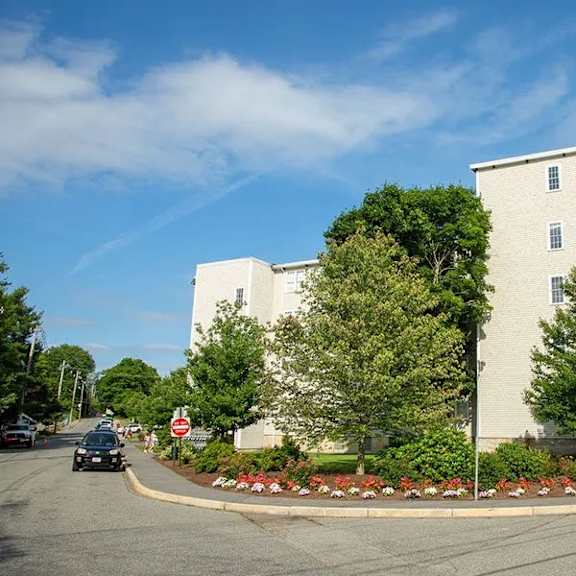 a large white building with a red stop sign in front of it.