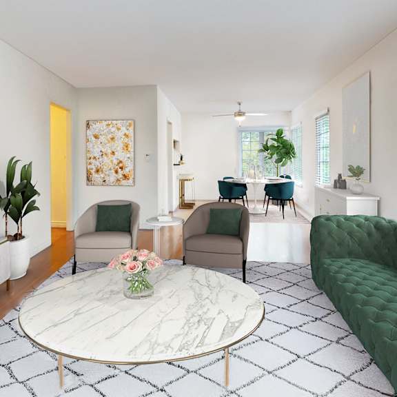 a living room with a green sofa and a white coffee table at sunset barrington gardens, los angeles, 90049