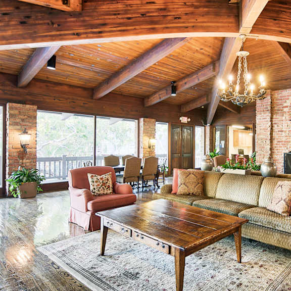 a living room with a fireplace and a couch at the meadows apartments, culver city , ca 90230