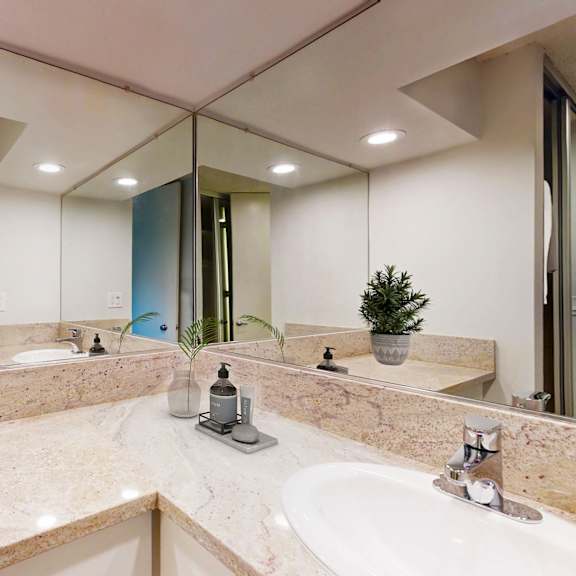 a large bathroom with a sink and a mirror at casa granada, los angeles, ca