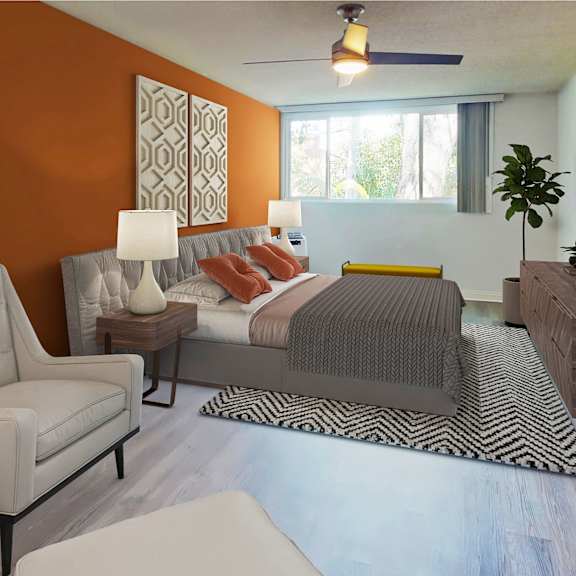 a bedroom with an orange accent wall and a bed at casa granada, los angeles, 90049