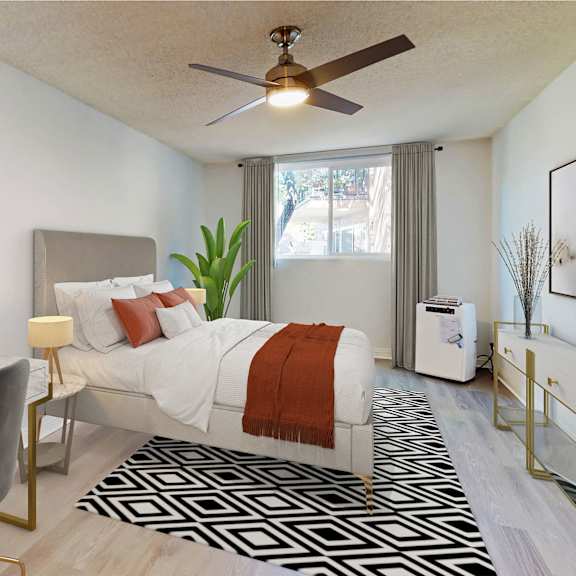 a bedroom with a bed and a ceiling fan at casa granada, california, 90049