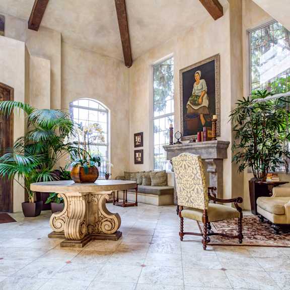 a living room filled with furniture and a table at l'estancia, studio city, 91604