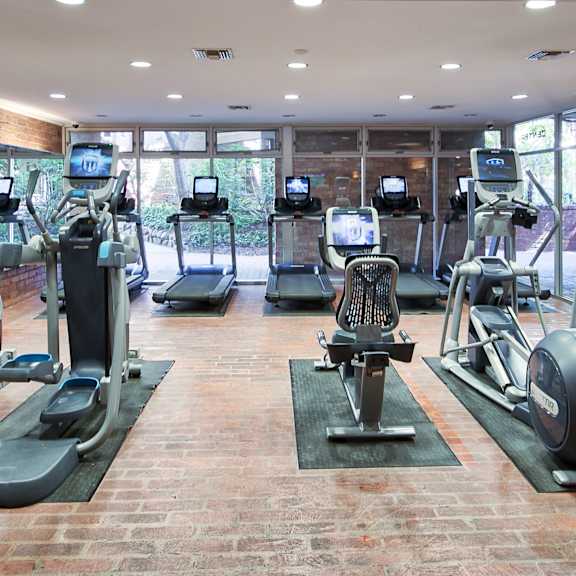 a gym with treadmills, exercise bikes, and other equipment at the meadows apartments, culver city , ca 90230