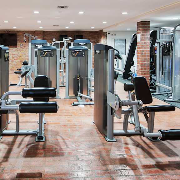 a gym with a variety of equipment including weights and machines at the meadows apartments, culver city , ca 90230