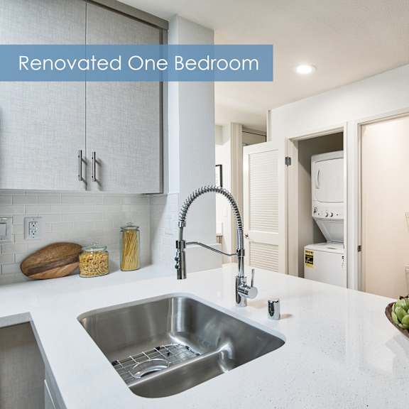 a renovated one bedroom apartment with a modern kitchen at the meadows apartments, culver city , ca 90230