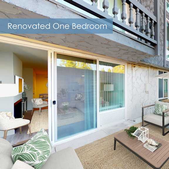 a renovated one bedroom apartment with a balcony and outdoor furniture at the meadows apartments, culver city , ca 90230