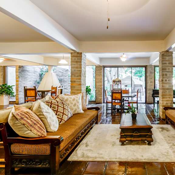 a living room with couches and a coffee table  at mediterranean village west hollywood, west hollywood, 90069