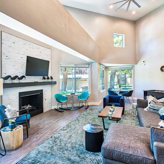a living room with a fireplace and a television at mountain vista, victorville, ca