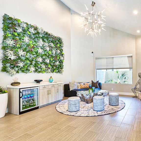 a living room with a green wall and a wooden bench at mountain vista, victorville, ca