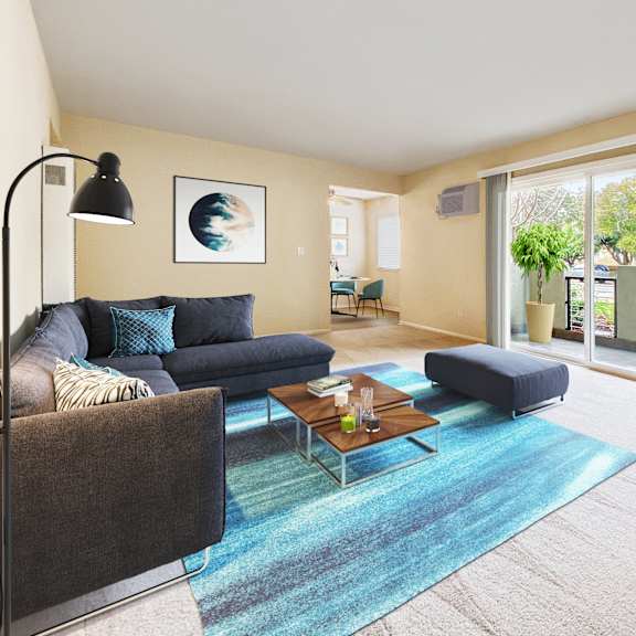 a living room with a blue rug and a grey couch at pleasanton place, pleasanton, ca, 94566
